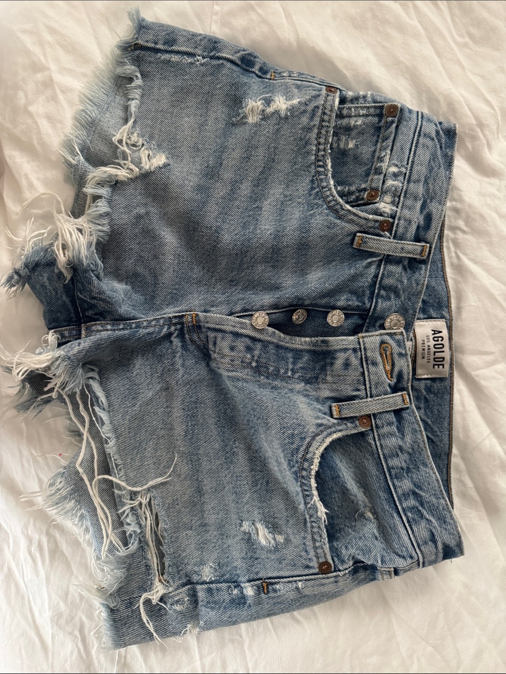 Agolde Distressed Light Blue High-Rise Denim Cutoff Shorts Parker model